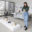 Shelby Charlesworth standing beside sculptural works in a studio space