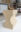 bronze sculpture resting on a hand-built ceramic pedestal with a sculpted geometric profile.