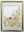 Framed textile artwork composed of botanical impressions and delicate floral imagery in soft greens, yellows, oranges, and blues, with a small bee flying across the composition.