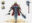 Character concept sheet showing an armored warrior with helmet, cape, battle axe, and weapon design studies.