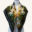 Square silk scarf featuring an intricate botanical design with fungi, moss, seed pods, and natural textures in green, gold, and black.