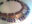 Contemporary collar necklace with silver panels, purple anodized niobium elements, and orange gemstones.