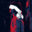 Stylized portrait of a blindfolded figure in profile, rendered in bold red, black, white, and navy tones against a dark background.