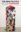 Book cover featuring a large compressed bundle of colorful textiles beneath the title The New Politics of the Handmade: Craft, Art and Design.