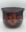 Engraved glass bowl with a smoky plum tint featuring flowing floral and scroll-like etched patterns around the interior and exterior.